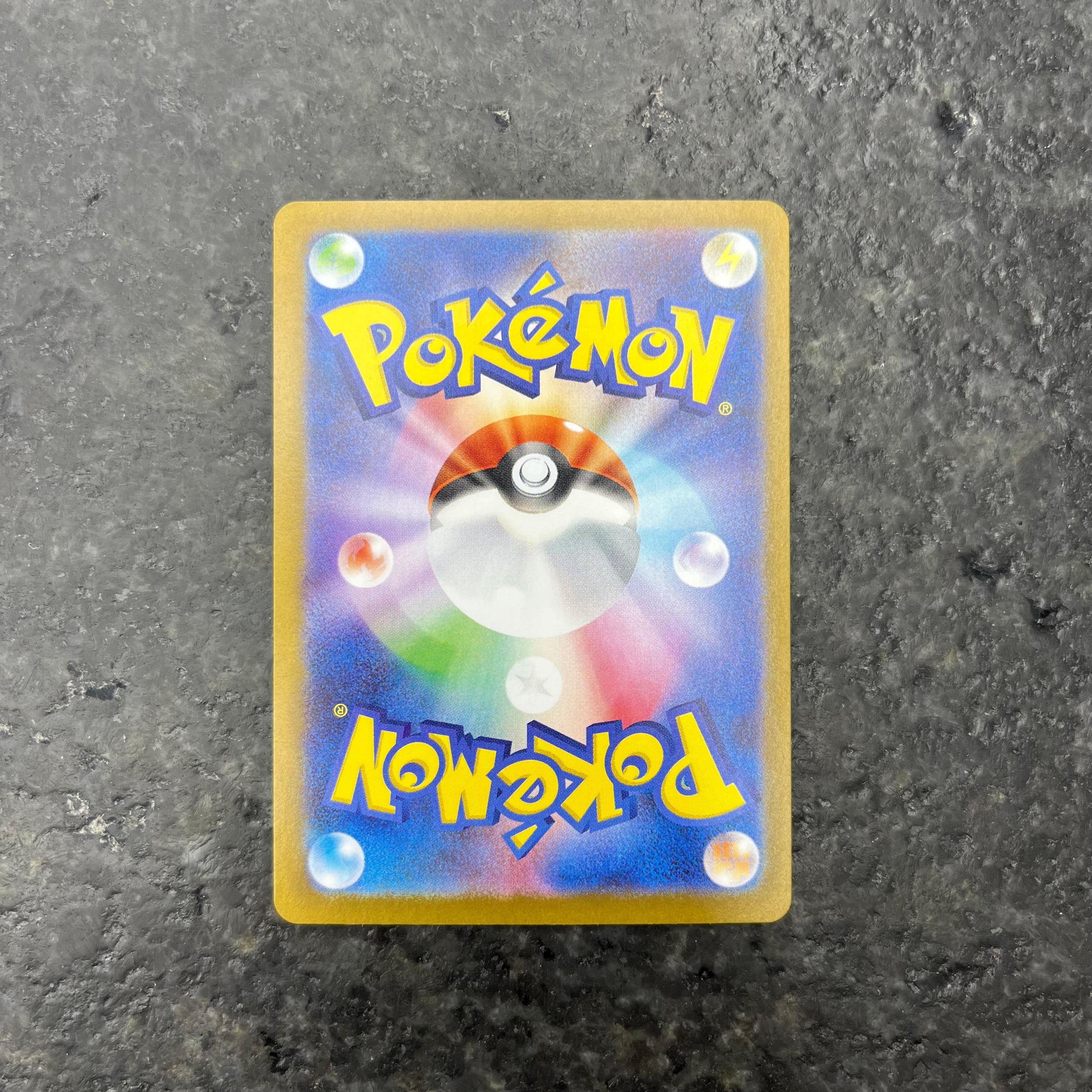 TEAM ROCKET’S MEWTWO GOLD RARE 130/098 (NM)