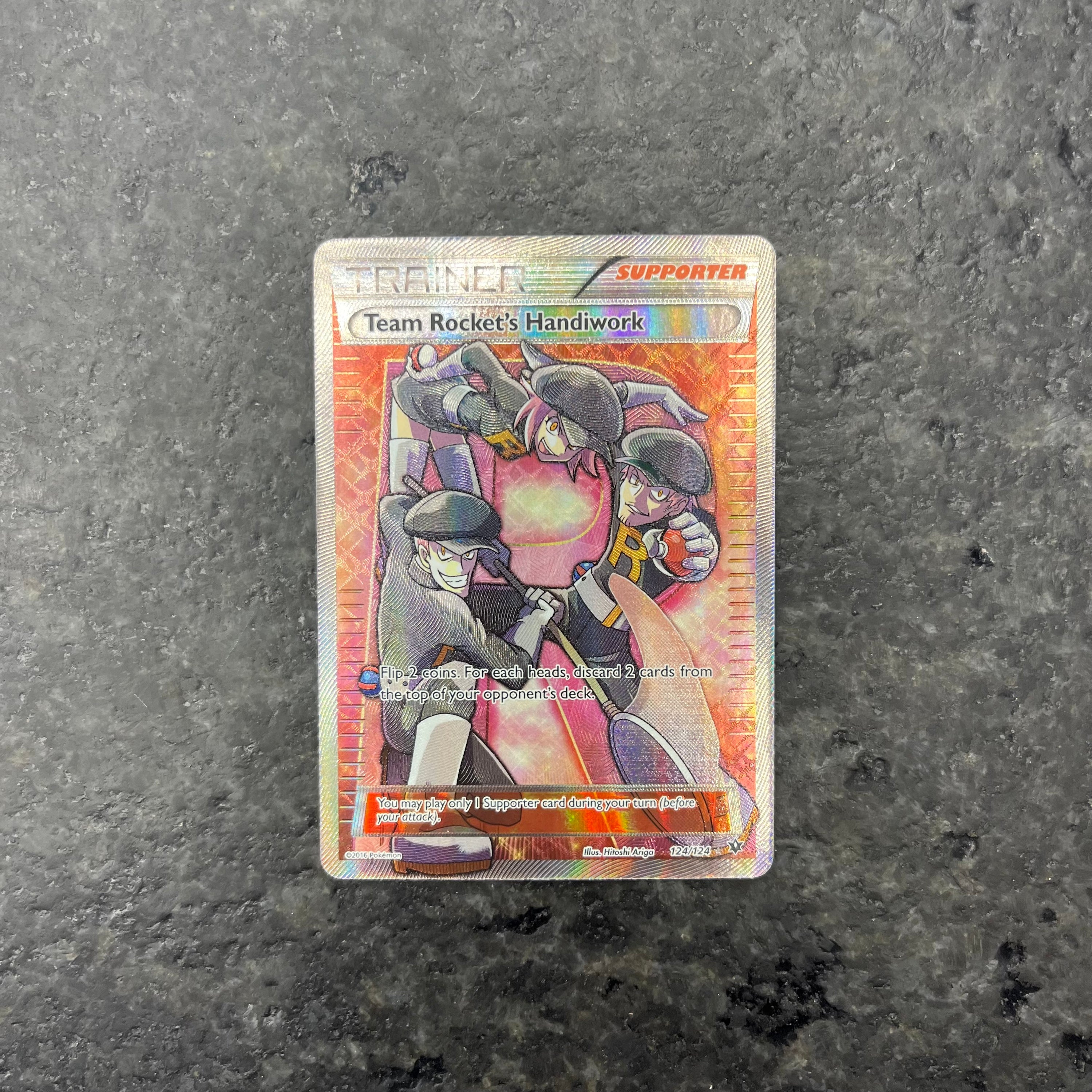 TEAM ROCKET’S HANDIWORK TRAINER FULL ART 124/124 (NM)